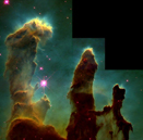 Image of Eagle Nebula with WFPC2. Pillars of yellow gas with a green background. Stars in the background are shown in pink.